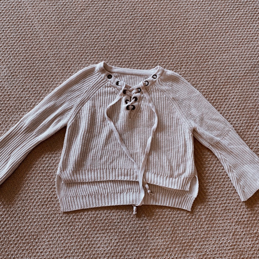 Bell sleeve lace up sweater
